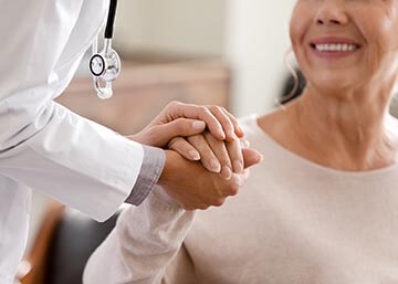 Doctor Holding Patient's Hand